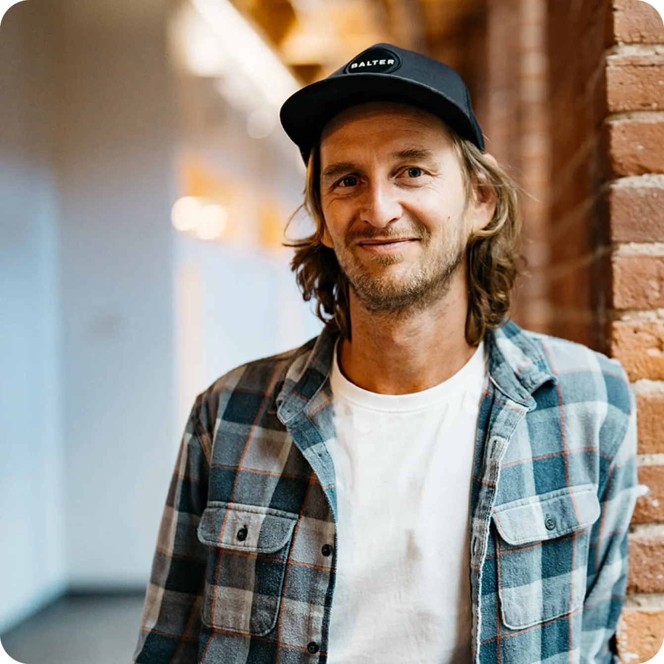 A Beeline Equity Guide in a Balter cap and flannel shirt