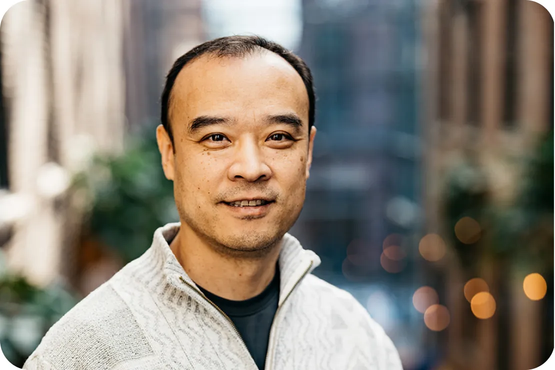 Portrait of an Equity Guide in a cream zip-up sweater